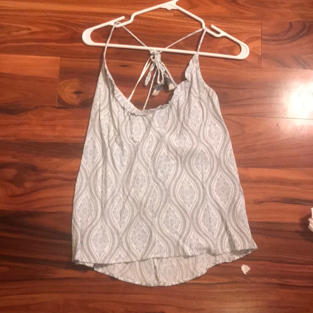 White and blue top with open back